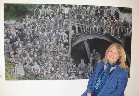 Sarah Maria Rhys at the King Street Gallery, Carmarthen, with her completed Brynhenllys Coliery painting